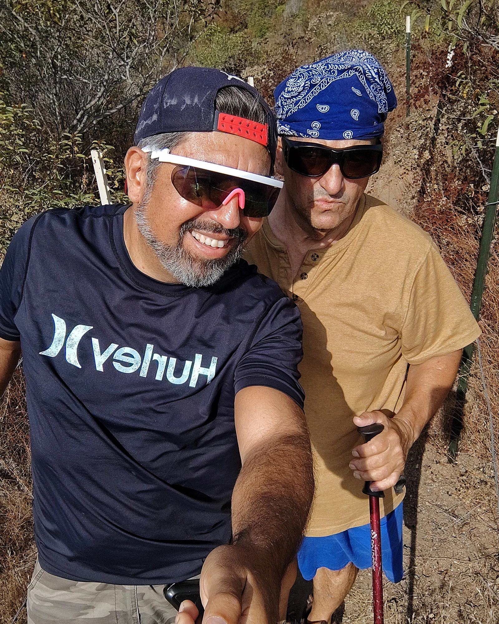 Two people smiling together on a trail
