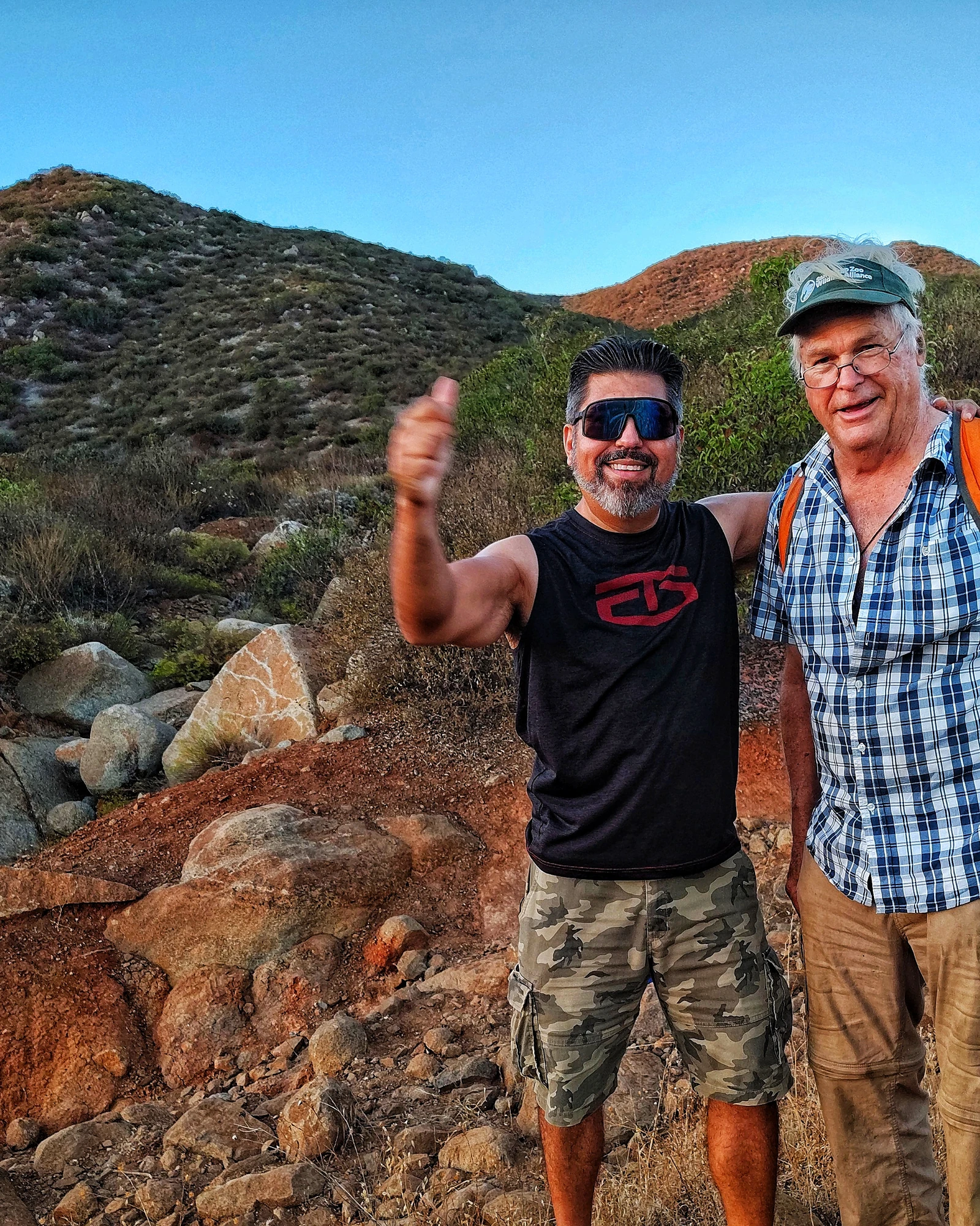Two people sharing an outdoor mountain moment